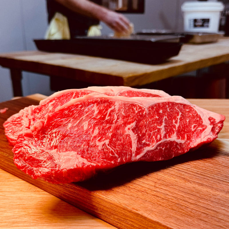 Freshly cut AAA Striploin steak from ForeQuarter Butcher Shop, ideal for grilling