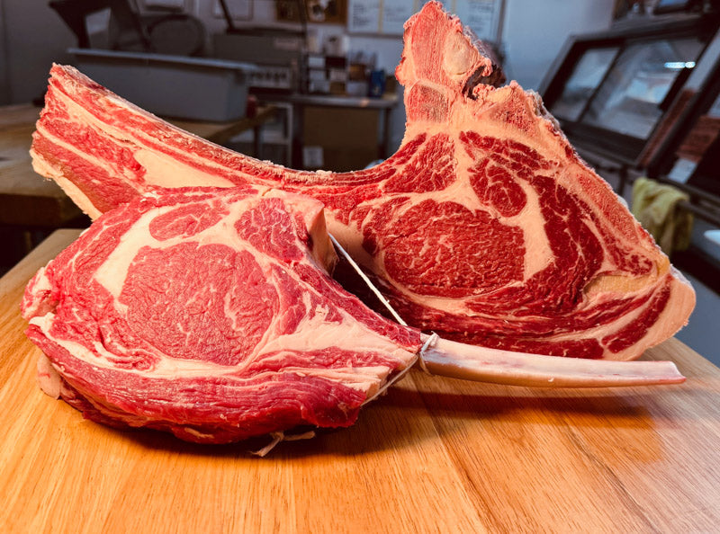 AAA Tomahawk Steak from ForeQuarter Butcher Shop in Kitchener, perfect for grilling with exceptional marbling and a bold beef flavor