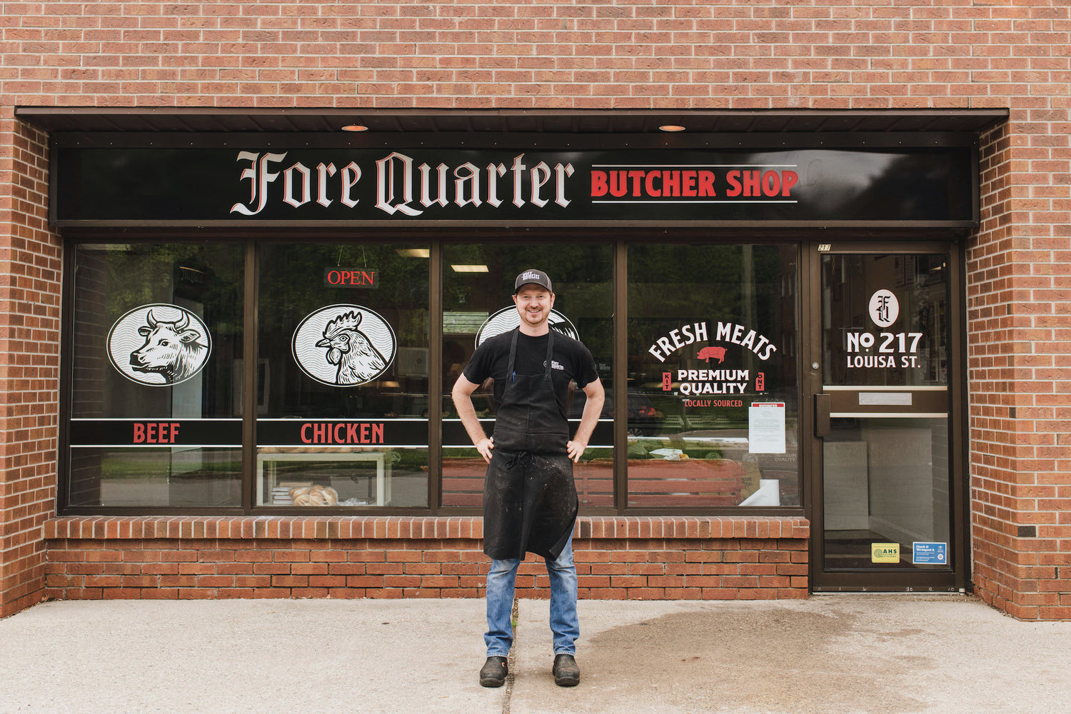Butcher Shop Owner Standing in front of his Kitchener Ontario Meat Store