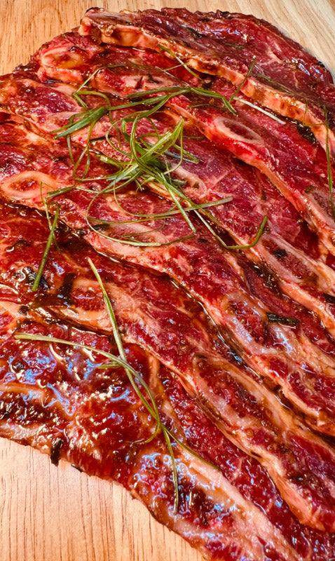 Close up of Korean Marinated Short Ribs with seasoning