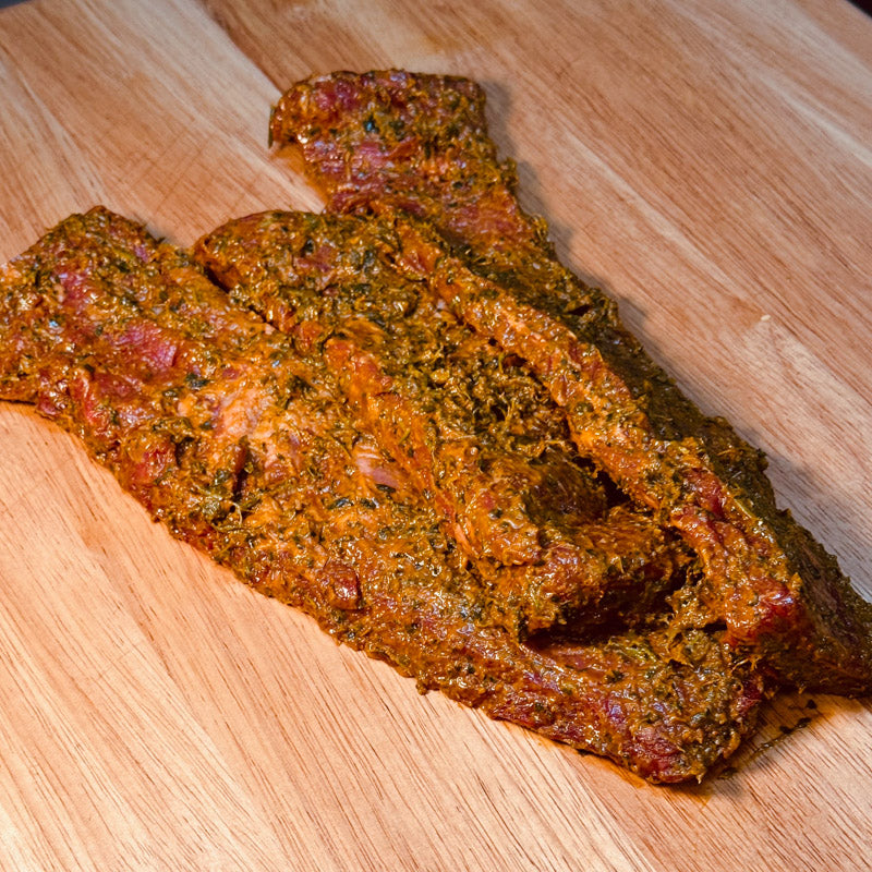 16oz of Marinated Mexican Skirt Steak on butcher block